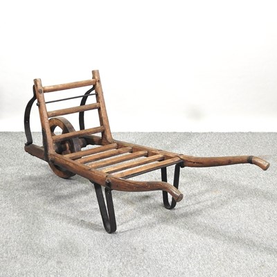 Lot 351 - A rustic wooden wheel barrow