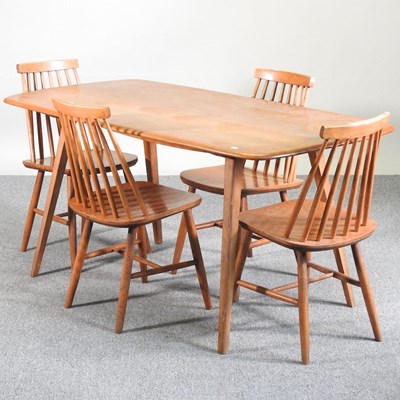 Lot 90 - A 1960's Ercol light elm dining table