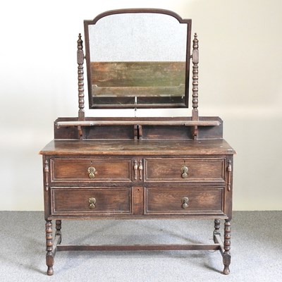Lot 242 - A Maple & Co oak dressing chest