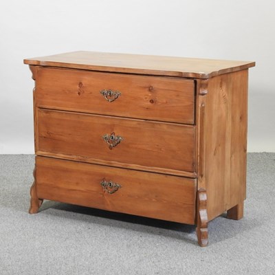 Lot 433 - A continental style pine serpentine chest