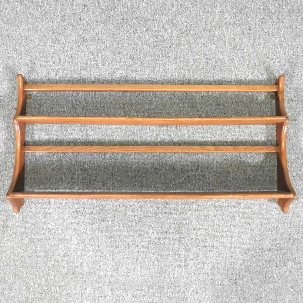 Lot 359 An Ercol hanging wall shelf