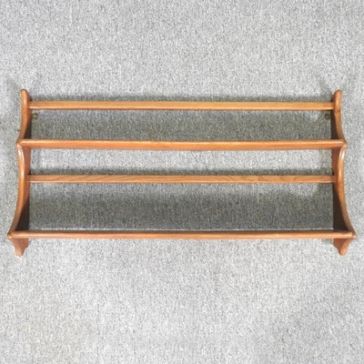 Lot 359 - An Ercol hanging wall shelf