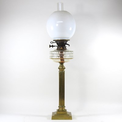 Lot 333 - A brass column oil lamp