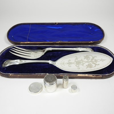 Lot 19 - A small silver nutmeg grater, together with another