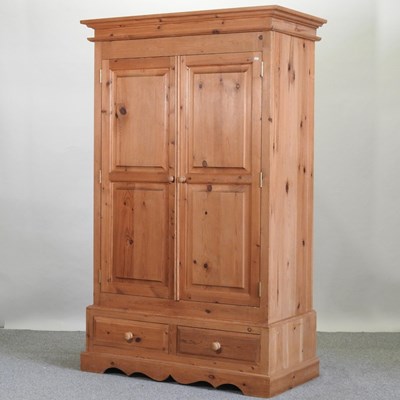 Lot 440 - A pine double wardrobe