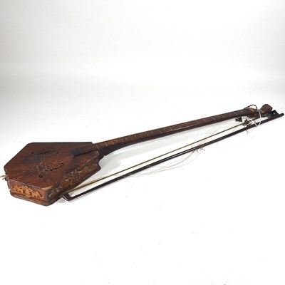 Lot 433 - A one string fiddle and bow