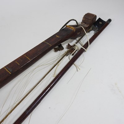 Lot 433 - A one string fiddle and bow