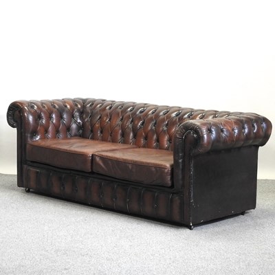 Lot 654 - A modern brown upholstered chesterfield sofa