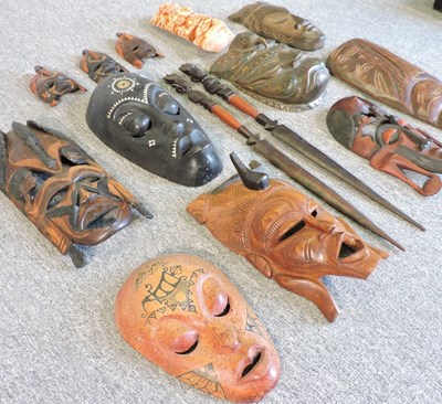 Lot 215 - A collection of carved wooden tribal masks