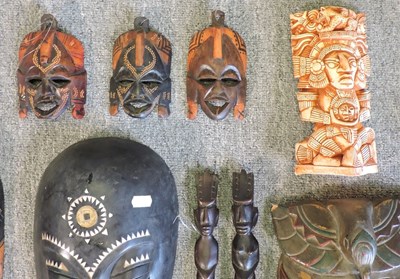 Lot 215 - A collection of carved wooden tribal masks