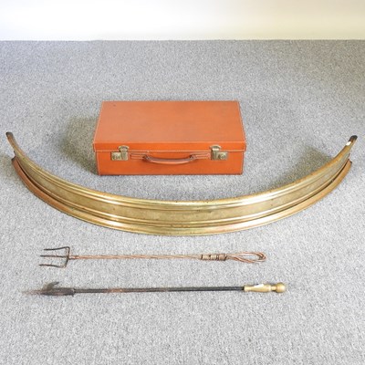 Lot 282 - A brass fender and tools