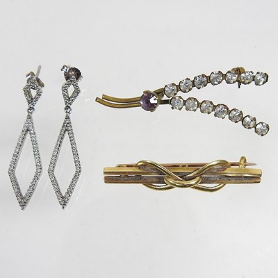 Lot 416 - A pair of gold and diamond earrings