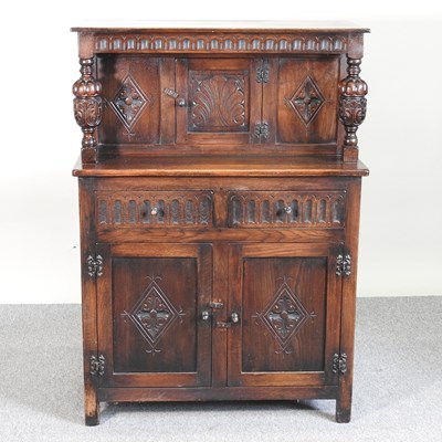 Lot 879 - An Old Charm style court cupboard