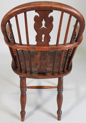 Lot 58 - A 19th century yew wood armchair