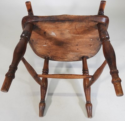 Lot 58 - A 19th century yew wood armchair