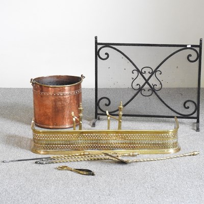 Lot 348 - A copper coal bucket, brass fender and fire tools