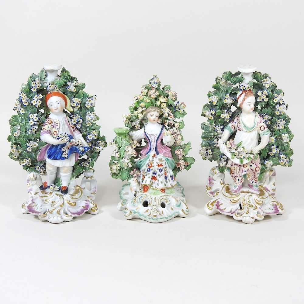 Lot 45 - A pair of Derby porcelain figures, together with another