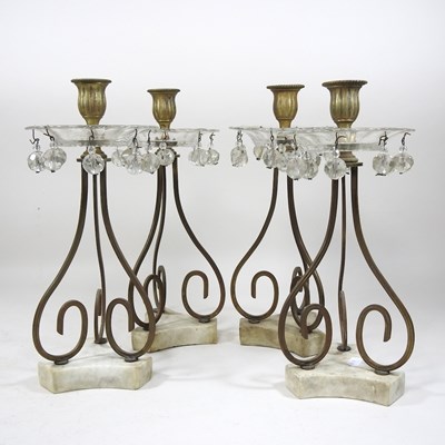 Lot 255 - A set of four shaped brass and alabaster candlesticks