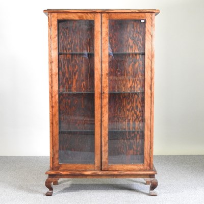 Lot 436 - An oak glazed bookcase