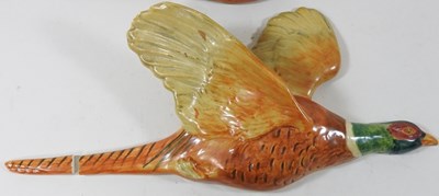 Lot 4 - A set of three Beswick pottery graduated wall mounted flying pheasants