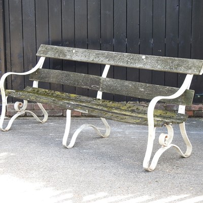 Lot 464 - An iron and slatted garden bench