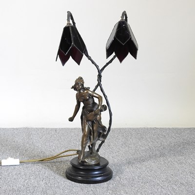 Lot 14 - A bronzed twin branch figural table lamp