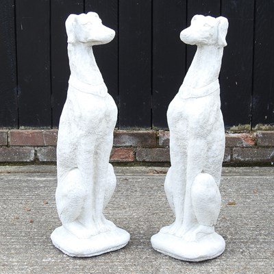 Lot 364 - A pair of stone greyhounds