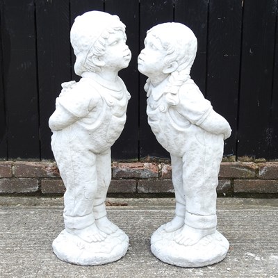 Lot 32 - A pair of cast stone garden figures