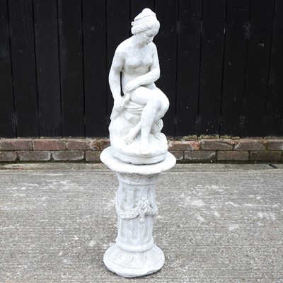 Lot 128 - A cast stone garden figure