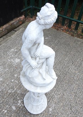 Lot 128 - A cast stone garden figure