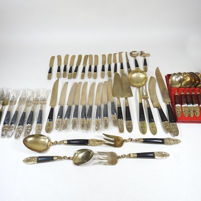 Lot 344 - A Burmese bronze canteen of cutlery