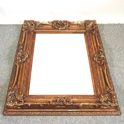 Lot 257 - An ornate gilt framed wall mirror