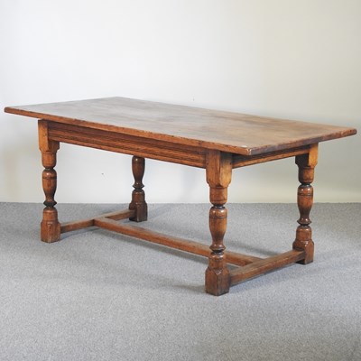 Lot 938 - An oak refectory dining table