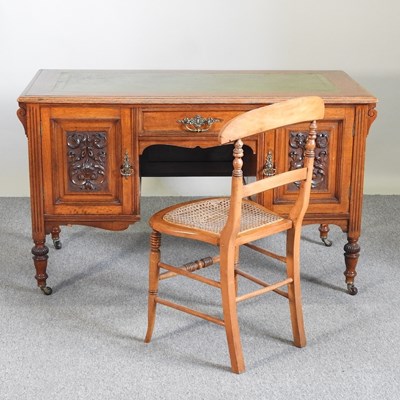 Lot 184 - An Edwardian oak desk