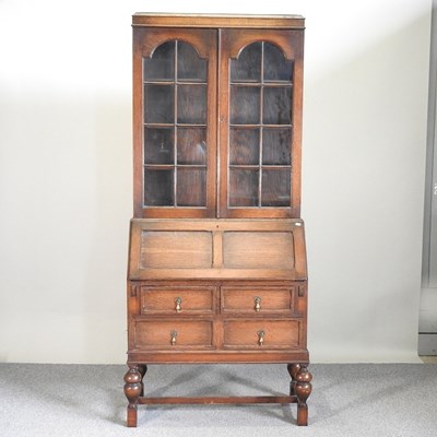 Lot 426 - A 1920's oak bureau bookcase