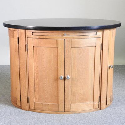 Lot 433 - An oak oval kitchen island