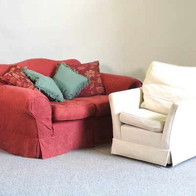 Lot 650 - A red upholstered sofa and armchair