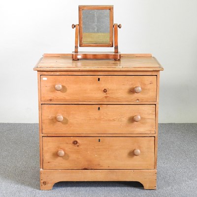 Lot 713 - A pine chest and a mirror