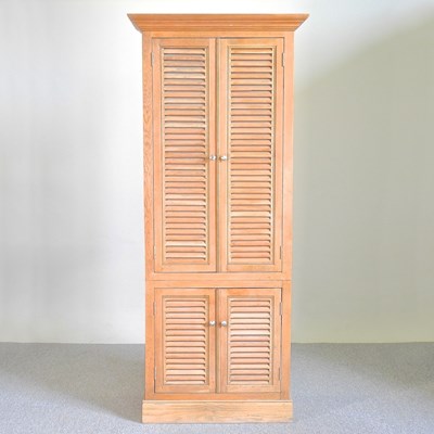 Lot 655 - An oak cabinet