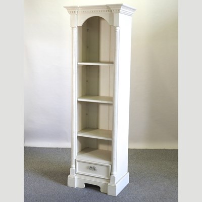 Lot 460 - A modern cream painted standing open bookcase