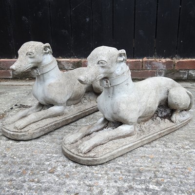 Lot 408 - A pair of cast stone greyhounds