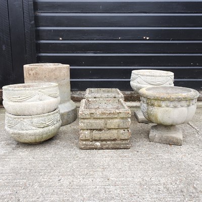 Lot 594 - A collection of stone garden pots