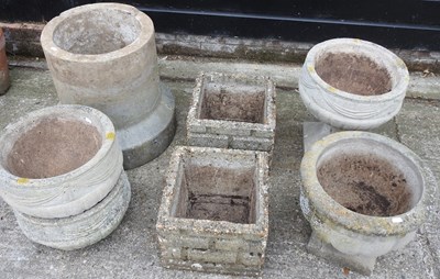 Lot 594 - A collection of stone garden pots