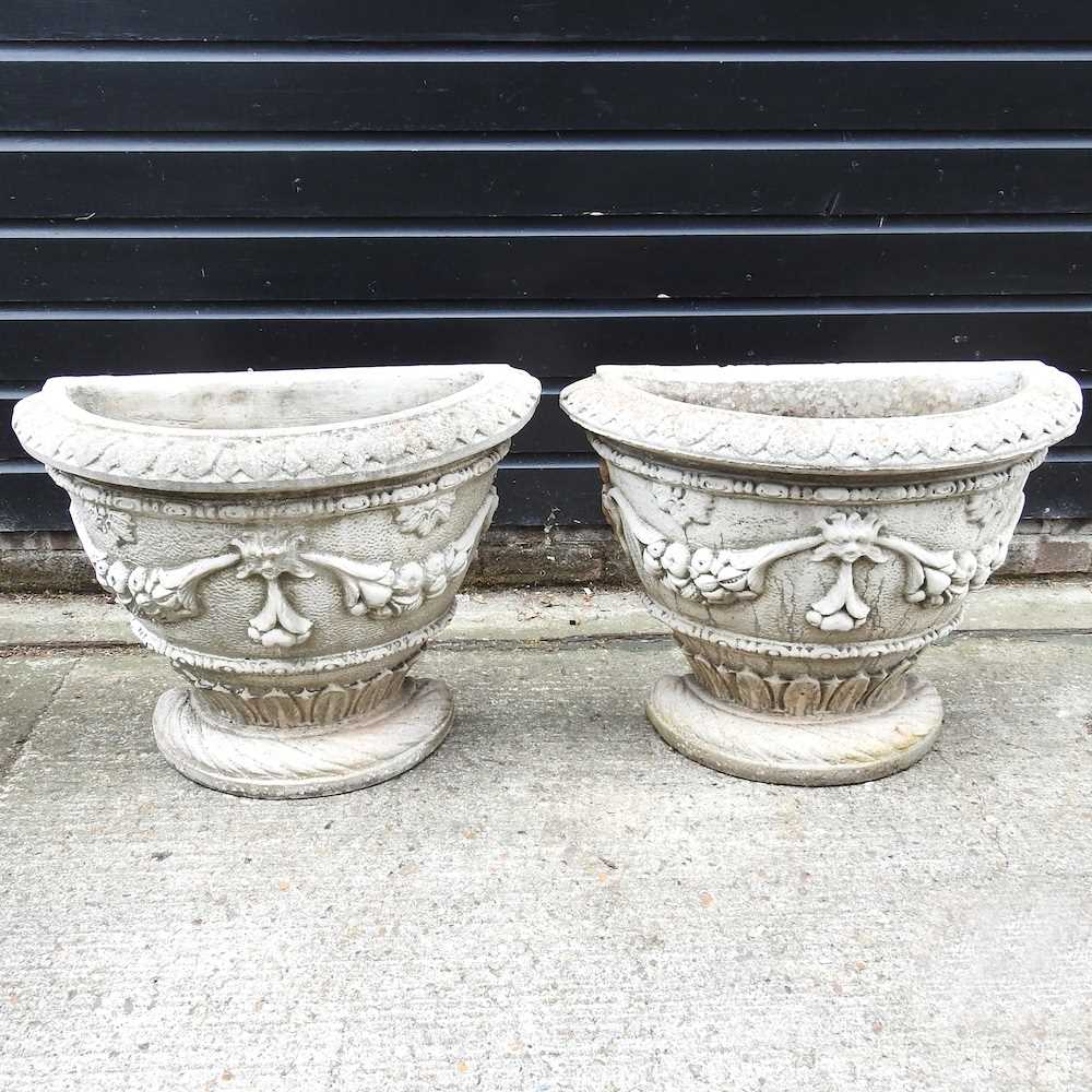 Lot 402 - A pair of cast stone garden pots