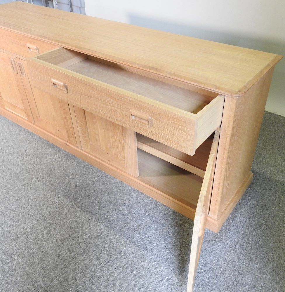 Lot 558 A modern light oak sideboard