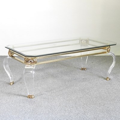 Lot 641 - A glass top coffee table