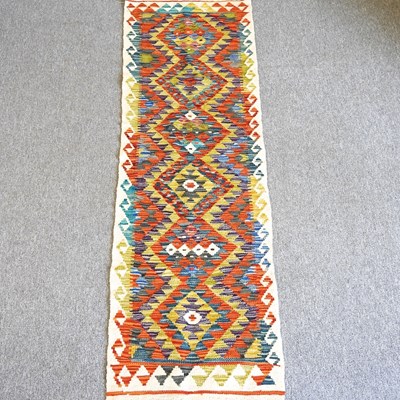 Lot 504 - A Kilim runner