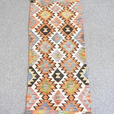 Lot 310 - A Kilim runner