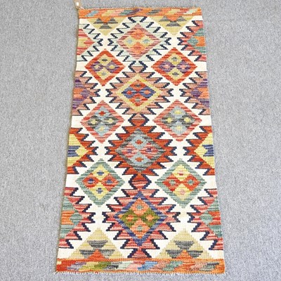 Lot 572 - A Kilim runner