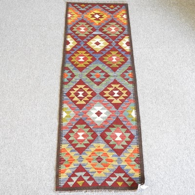 Lot 637 - A Kilim runner